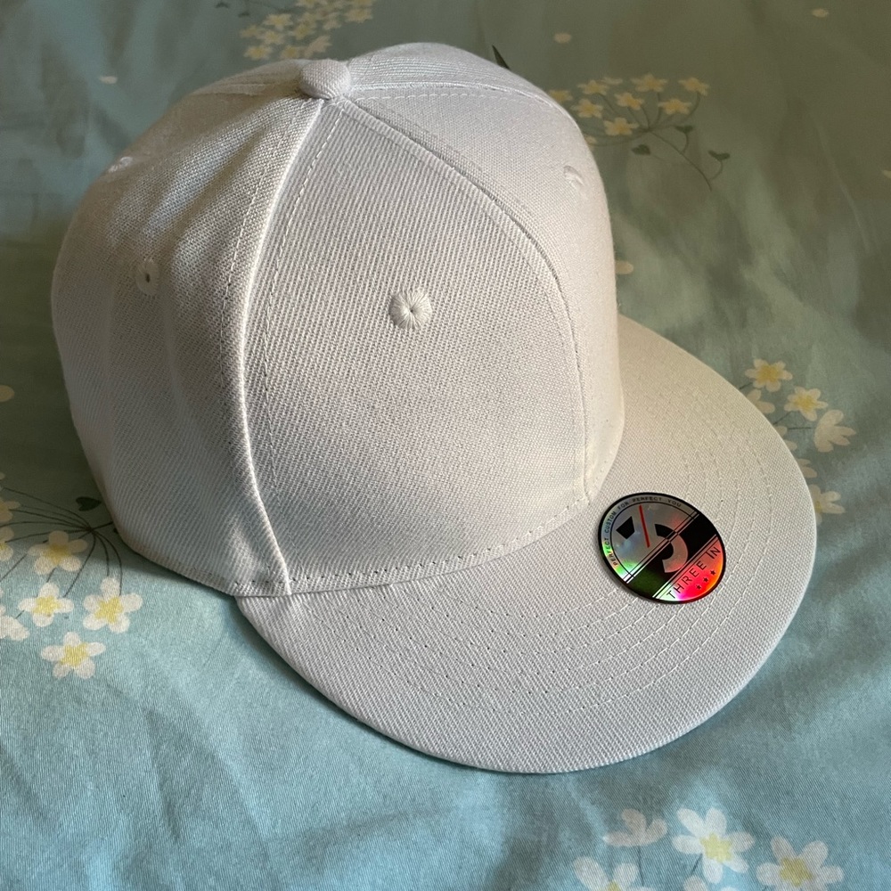 three in white cap